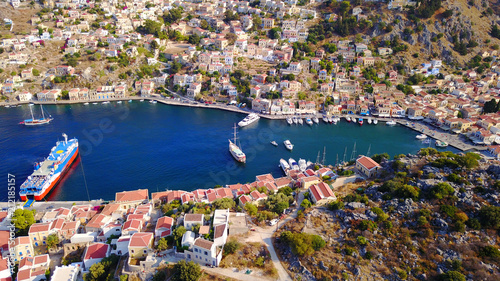 Aerial brid's eye photo taken by drone of Yalos, iconic port of Symi island, Dodecanese, Greece © aerial-drone