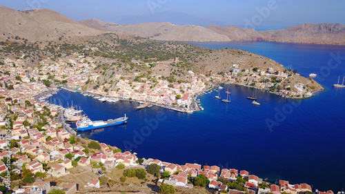 Aerial brid's eye photo taken by drone of Yalos, iconic port of Symi island, Dodecanese, Greece photo