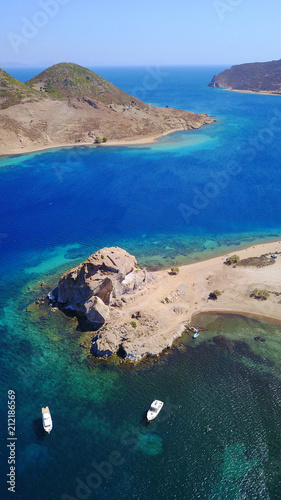 Aerial birds eye view photo taken by drone of famous rock of Kalikatsou in Petra beach, Patmos island, Dodecanese, Greece