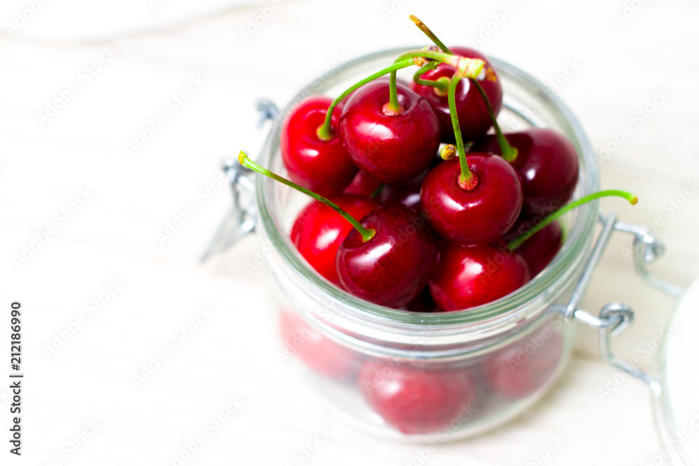 fresh cherries in jar for Homemade preserved cherry jam, preserves for winter - sweet eating, dessert and food concept fresh cherries in jar for Homemade preserved cherry jam, preserves for winter - sweet eating, dessert and food concept