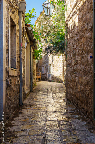 Old historical buildings in the narrow street at ancient city Budva  Montenegro