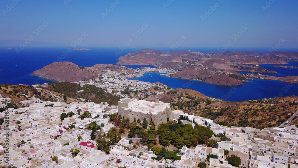 Obraz premium Aerial bird's eye view photo taken by drone of massive fortified stone Monastery of Saint John the Apostle with views to Aegean sea, Patmos island, Greece
