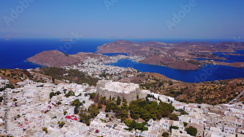 Aerial bird s eye view photo taken by drone of massive fortified stone Monastery of Saint John the Apostle with views to Aegean sea  Patmos island  Greece