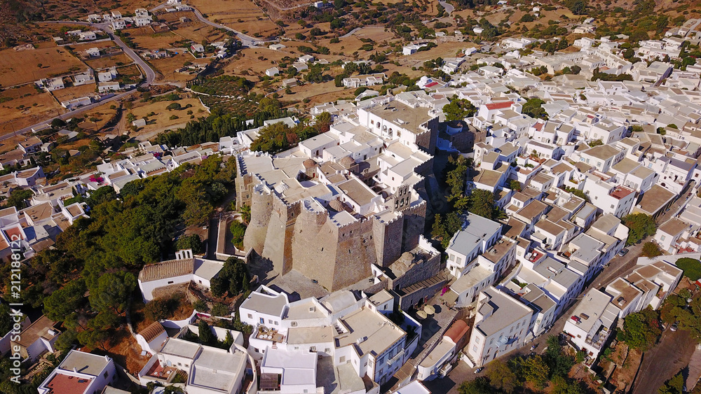Fototapeta premium Aerial bird's eye view photo taken by drone of Massive fortified stone Monastery of Saint John the Apostle, Patmos island, Greece