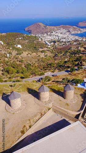 Aerial bird's eye view photo taken by drone of iconic windmills in Chora of Patmos island, Greece