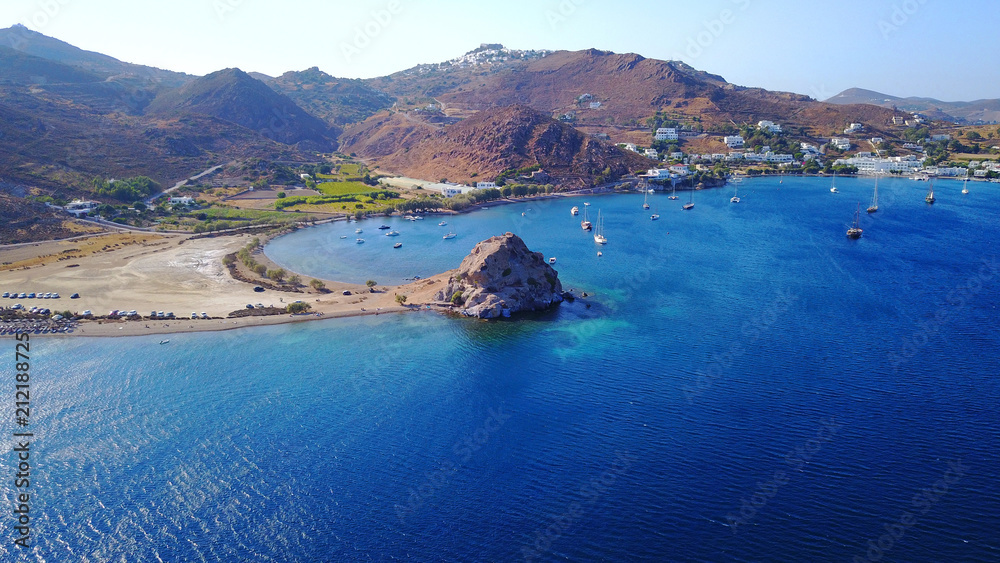 Fototapeta premium Aerial birds eye view photo taken by drone of famous rock of Kalikatsou in Petra beach, Patmos island, Dodecanese, Greece