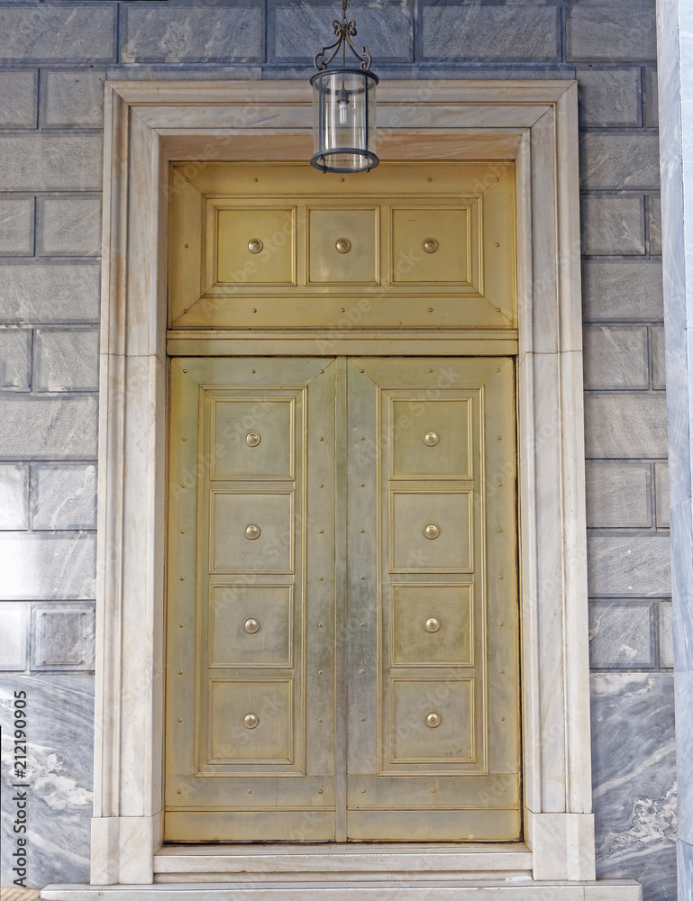bronze metal elegant door of a banking institution