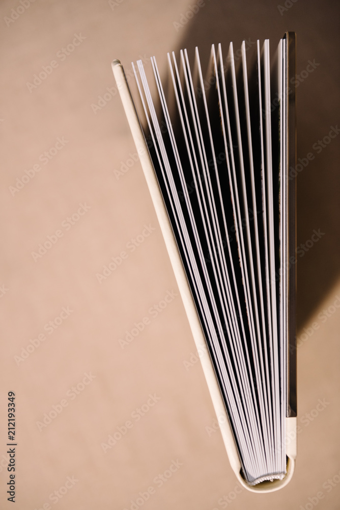Photobooks in the cover of white leatherette, view from different sides Photobooks in the cover of white leatherette, view from different sides
