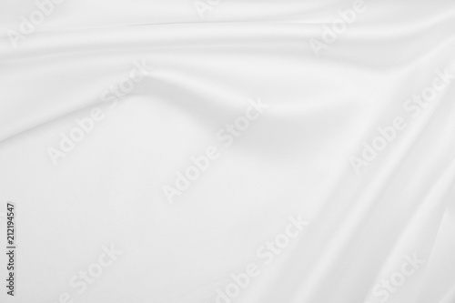 Smooth elegant white silk or satin luxury cloth texture as wedding background. Luxurious background design