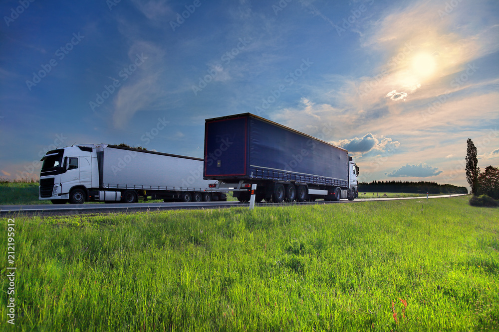 Truck transportation on the road at sunset Truck transportation on the road at sunset