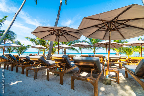 Umbrella and chair around beach and sea for travel and vacation