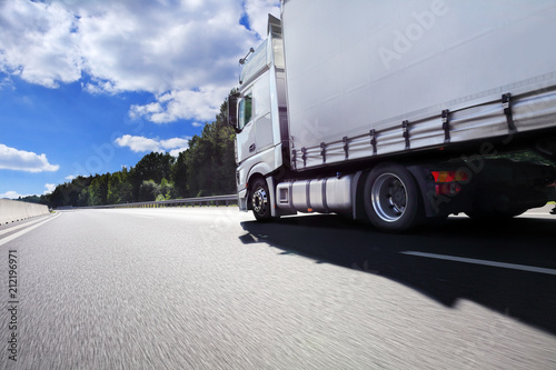 A fast truck running on the highway