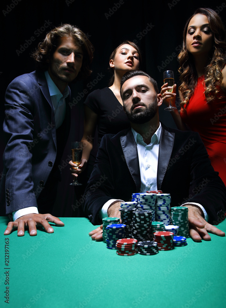 Attractive young caucasian man make bet in the casino Attractive young caucasian man make bet in the casino