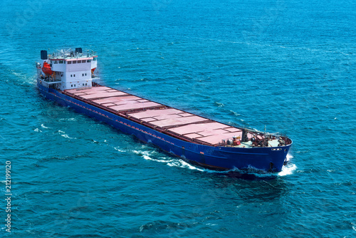 Large cargo ship in the blue sea