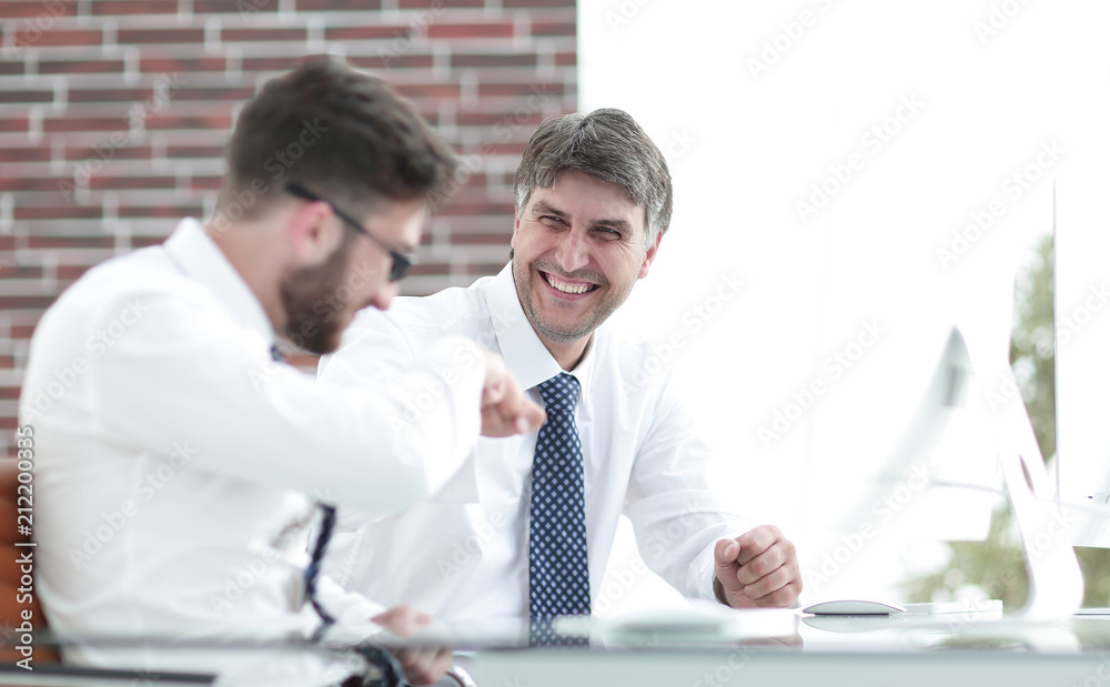 Colleagues shake hands as a sign of success Colleagues shake hands as a sign of success