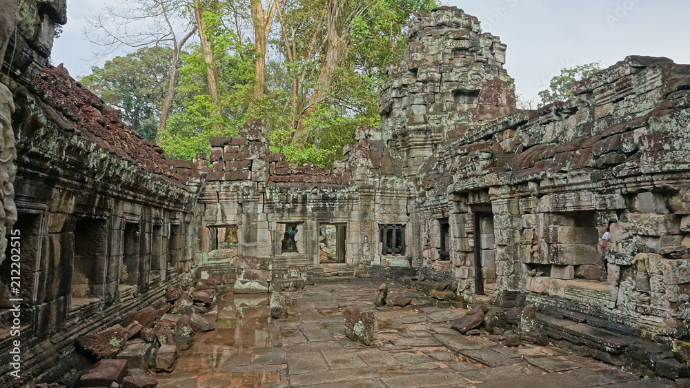 Breathtaking view of decaying ruins of famous ancient Angkor Wat temple complex.