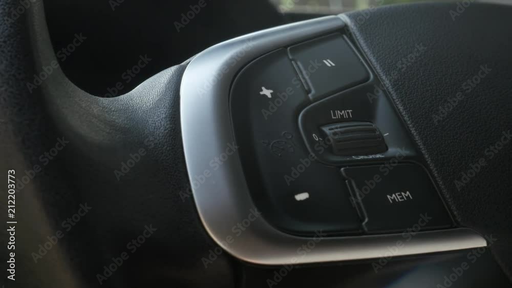 Controling cruising speed on car steering wheel 4K footage Controling cruising speed on car steering wheel 4K footage