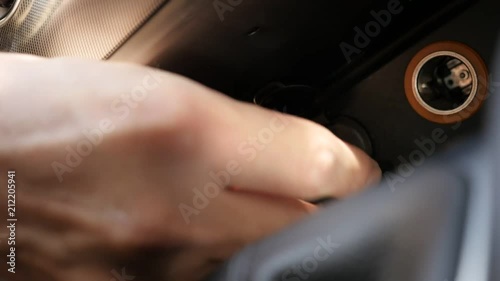 Slow motion USB flash drive plugging in car photo