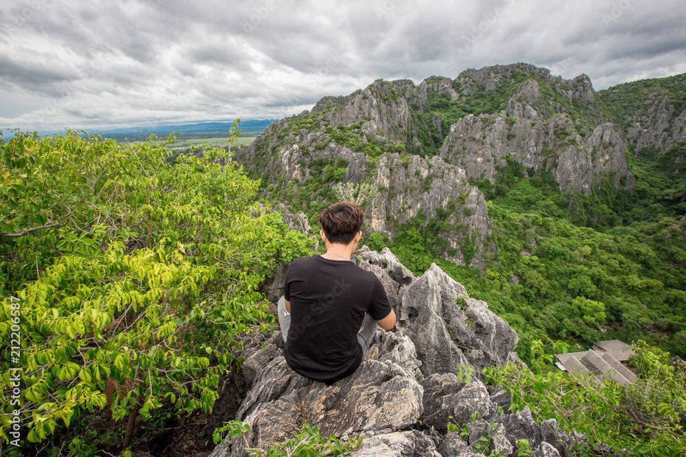 Tourists climb the natural view (Khao Daeng viewpoint) 360 degree natural scenery located in Prachuap Khiri Khan, Thailand.