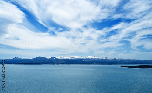 Lake Sevan in Armenia, beautiful view of lake on a sunny bright spring day, beautiful clouds