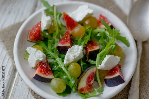 Beautiful vegetarian salad with goat cheese and figs.