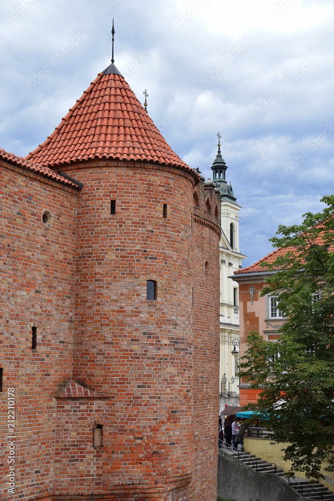 Part of old red brick tower barbican fortress in Warsaw Poland with copy space for text on sky.