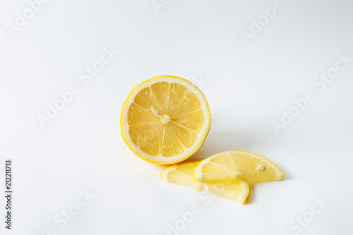  Juicy yellow lemon and lemon slices photo