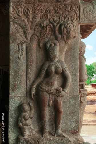 Carved figure of a tall, slender lady in a lovely posture. Nandi mandapa, Virupaksha Temple, Pattadakal temple complex, Pattadakal, Karnataka photo