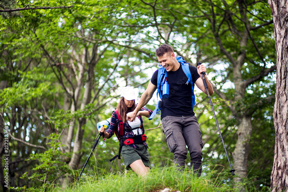 Couple of hikers have fun on their hiking trip Couple of hikers have fun on their hiking trip