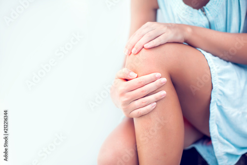 Wallpaper Mural Closeup woman hand holding knee with pain on bed, health care and medical concept Torontodigital.ca