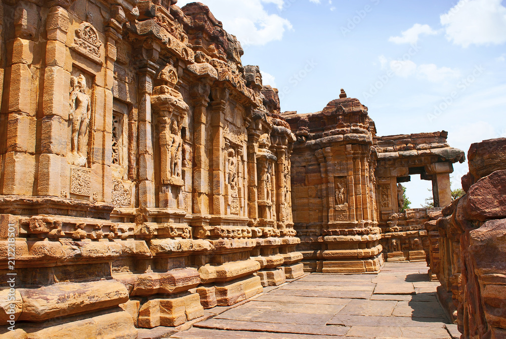 Exterior view of the sourhern walls. The Devakoshthas, Virupaksha temple, Pattadakal temple complex, Pattadakal, Karnataka. Southwest view. Western mukh-mandapa is seen on the right.