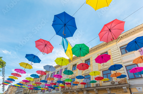 Colorful umbrellas hanging on the street in Lviv photo