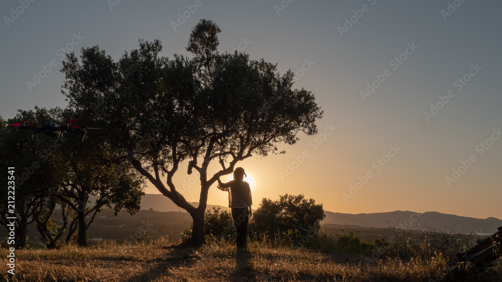 Fototapeta premium young woman staring at sunset in Zakynthos, Greece