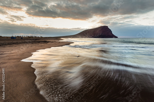 Beach Tejita and Special Nature Reserve Red Mountain, Tenerife, Spain. Photography with long exposure time. photo