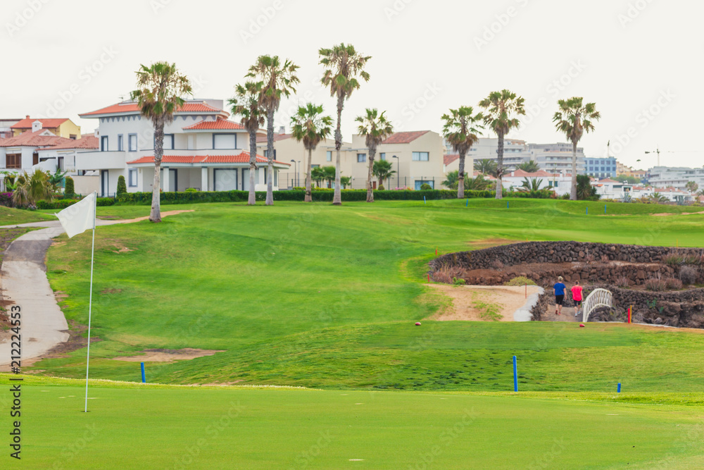 Golf course along rocky coastline. Tenerife, Spain. Golf course along rocky coastline. Tenerife, Spain.