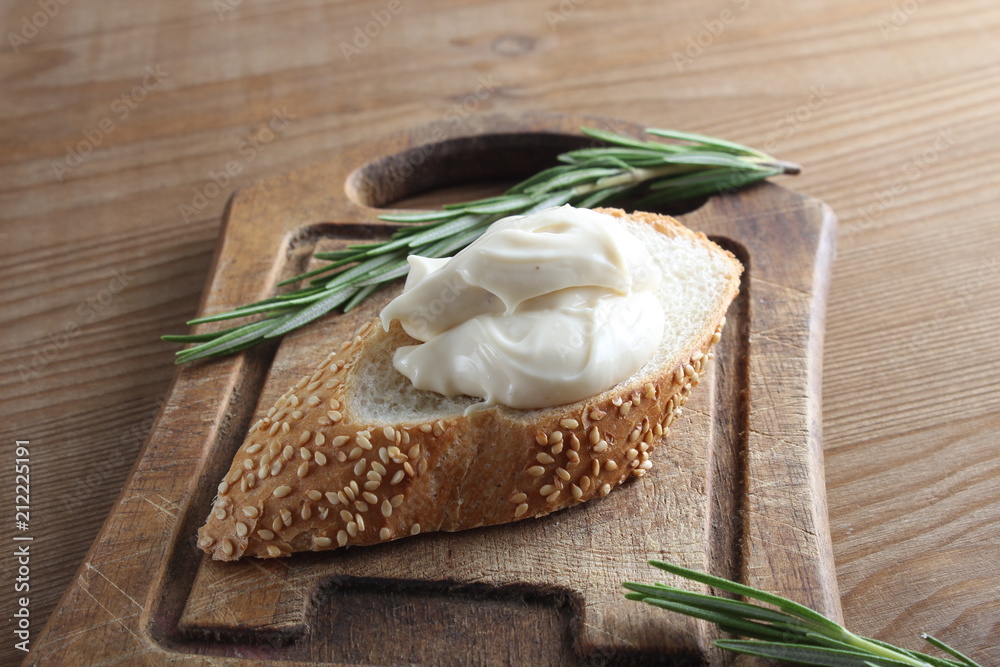 processed cheese bread on a wooden background processed cheese bread on a wooden background