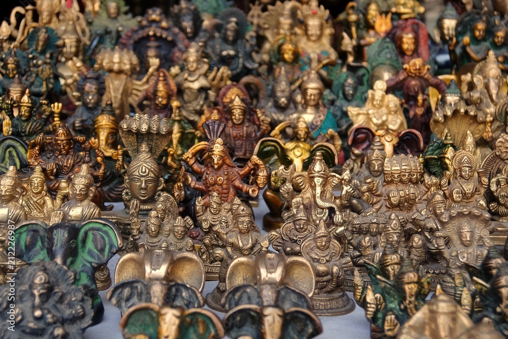 Fototapeta premium Small bronze statuettes on the street market in Rishikesh.