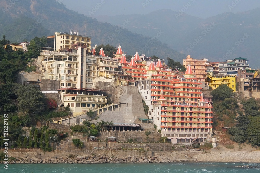 View of hinduist temple Shri Makar Vahani Ganga Jee and Sita Ram Dham Ashram on the riverbank of Ganga in Rishikesh