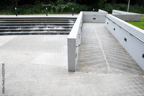 Zigzag ramp for the wheelchair and stairs for normal people adjoining