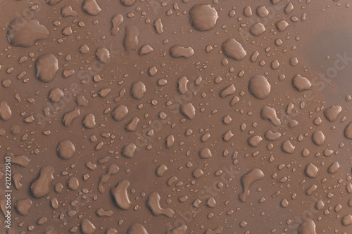 Grey water droplet on the roof of car