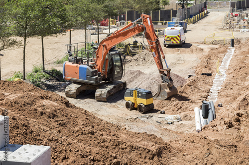 Building site featuring a large orange digger with no people