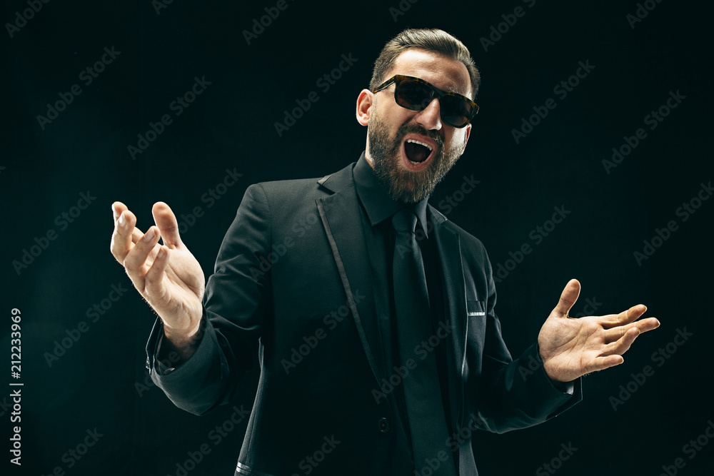 The barded man in a suit at black studio The barded man in a suit at black studio