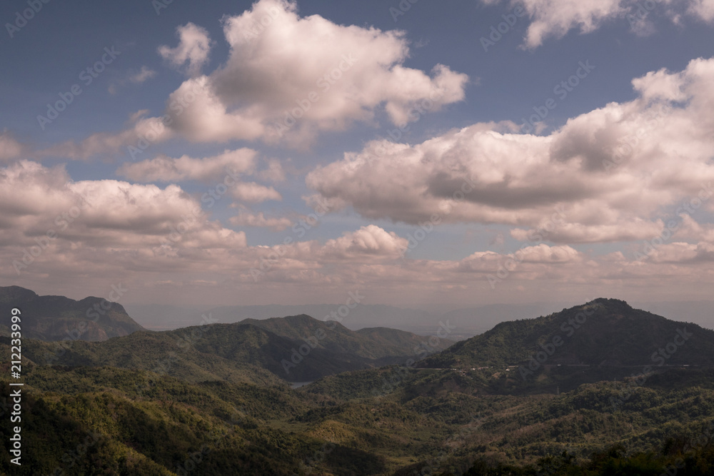 landscape view of green mountains under white clouds and blue sky in Thailand landscape view of green mountains under white clouds and blue sky in Thailand