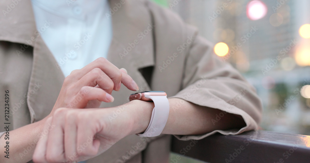 Woman use of smart watch at outdoor