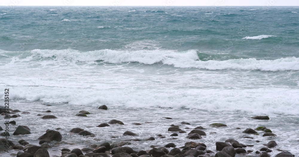Sea wave stony beach