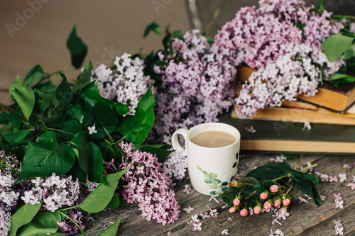 Cup of tea   flowers  on dark wooden background