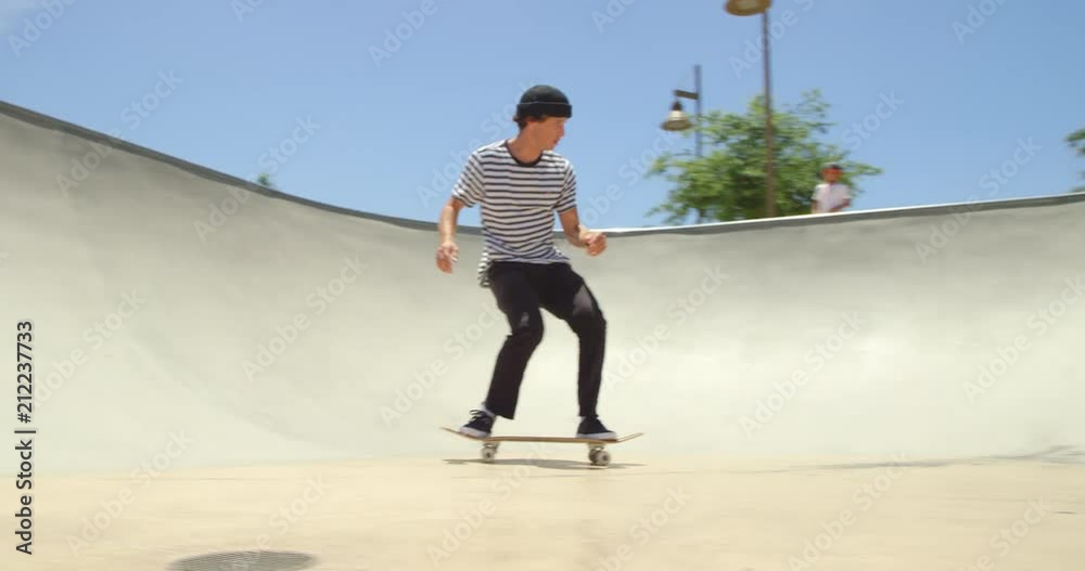 Skateboarder does extreme air off ramp isolated in sky on sunny day 