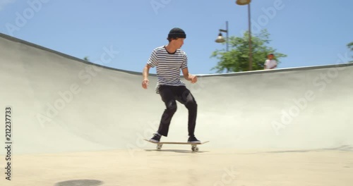 Skateboarder does extreme air off ramp isolated in sky on sunny day 