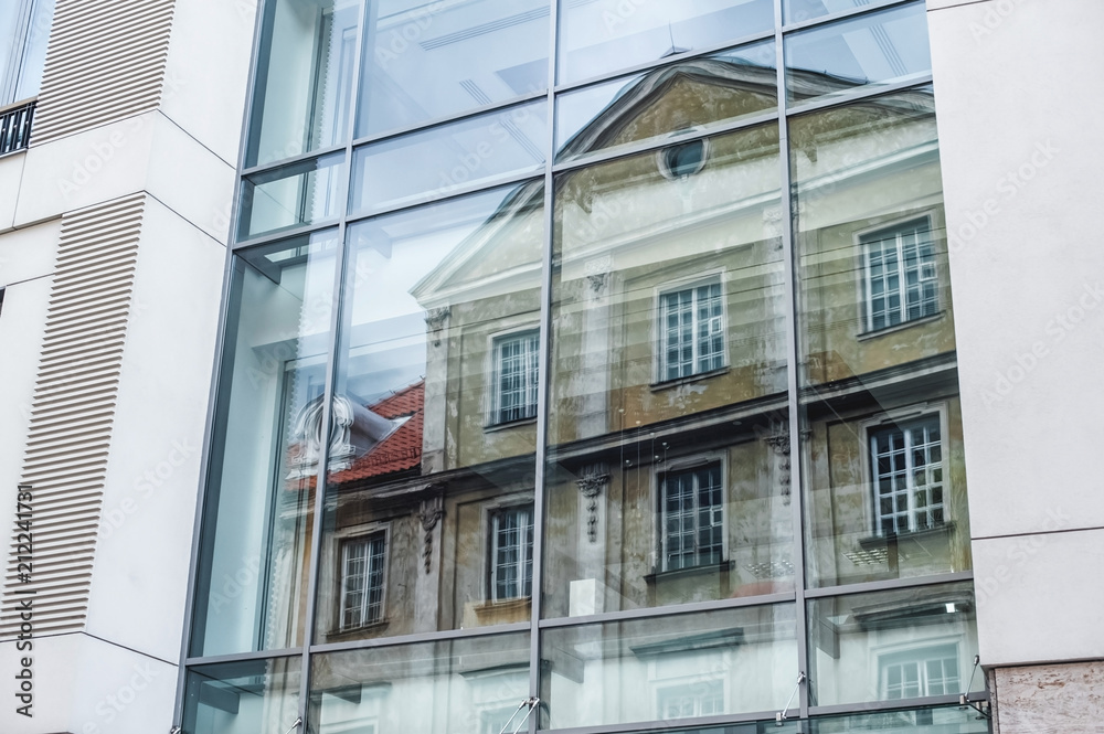 ; view of skyscraper windows; old city in the reflection of a new building; mixture of glass, metal and concrete ; view of skyscraper windows; old city in the reflection of a new building; mixture of glass, metal and concrete