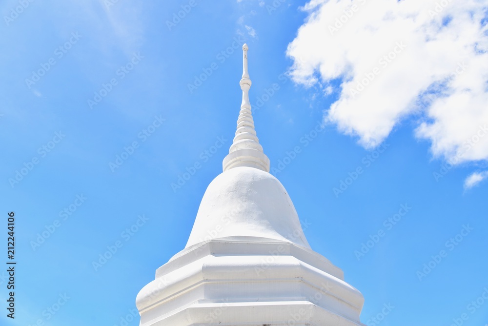 White Buddhist Pagoda Isolated Against Blue Skies